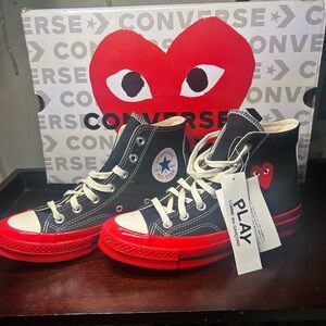 CDG x Converse Chuck Taylor High Top sneakers.